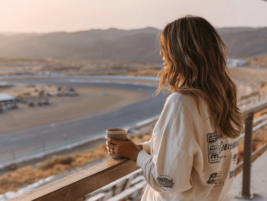 F1 Race Weekend Explained: Practice, Qualifying & Race Day Blog - Woman overlooking track